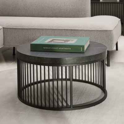Cella Round Coffee Table with a Black Marble Effect, Modern Style – in a room setting