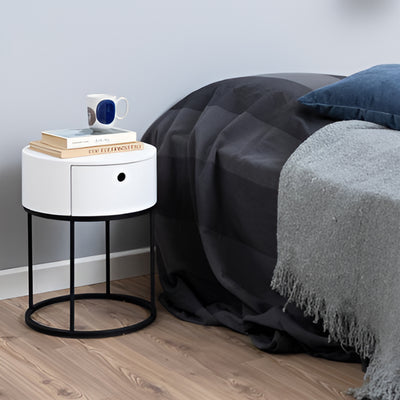 Ronda Round Bedside Table with a Drawer, Minimalist Style – in a room setting