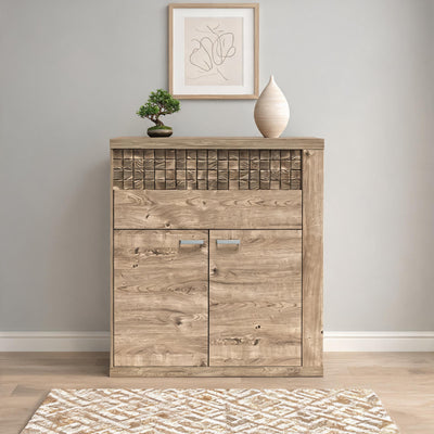 Dressoir Korin 102x119 tegen een lichtgrijze muur met bonsai en poster – ladekast voor de hal of woonkamer